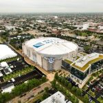 Top 10 Largest NBA Arenas: A general overall aerial view of the United Center and the skyline in Chicago, Illinois, on August 1, 2024.