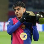 Best Football Academies in the World: Lamine Yamal, is seen presenting his Golden Boy trophy to Barcelona fans during a La Liga game.